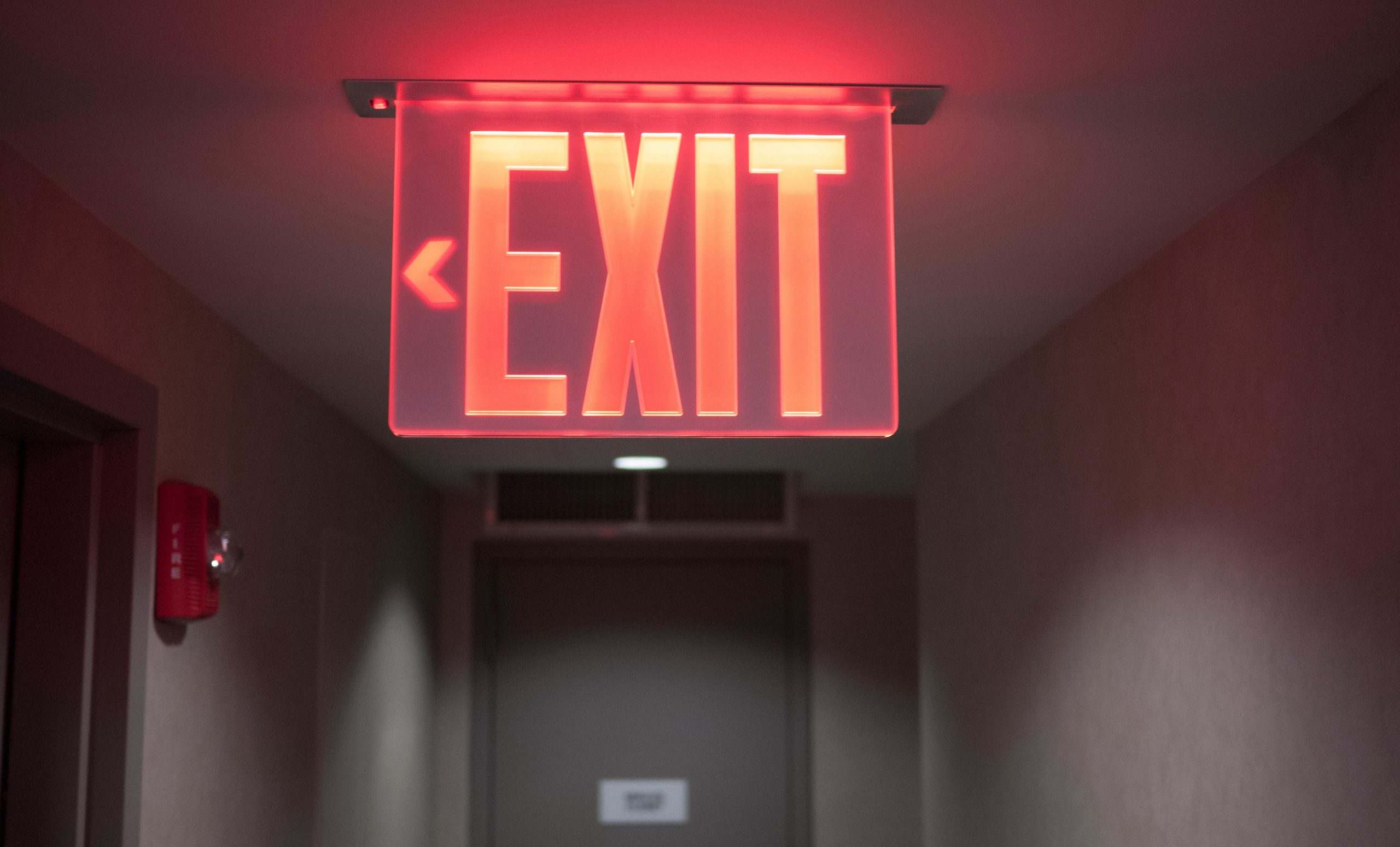 Glowing red exit sign.